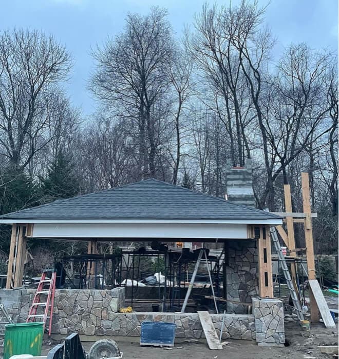 Covered outdoor kitchen with fireplace