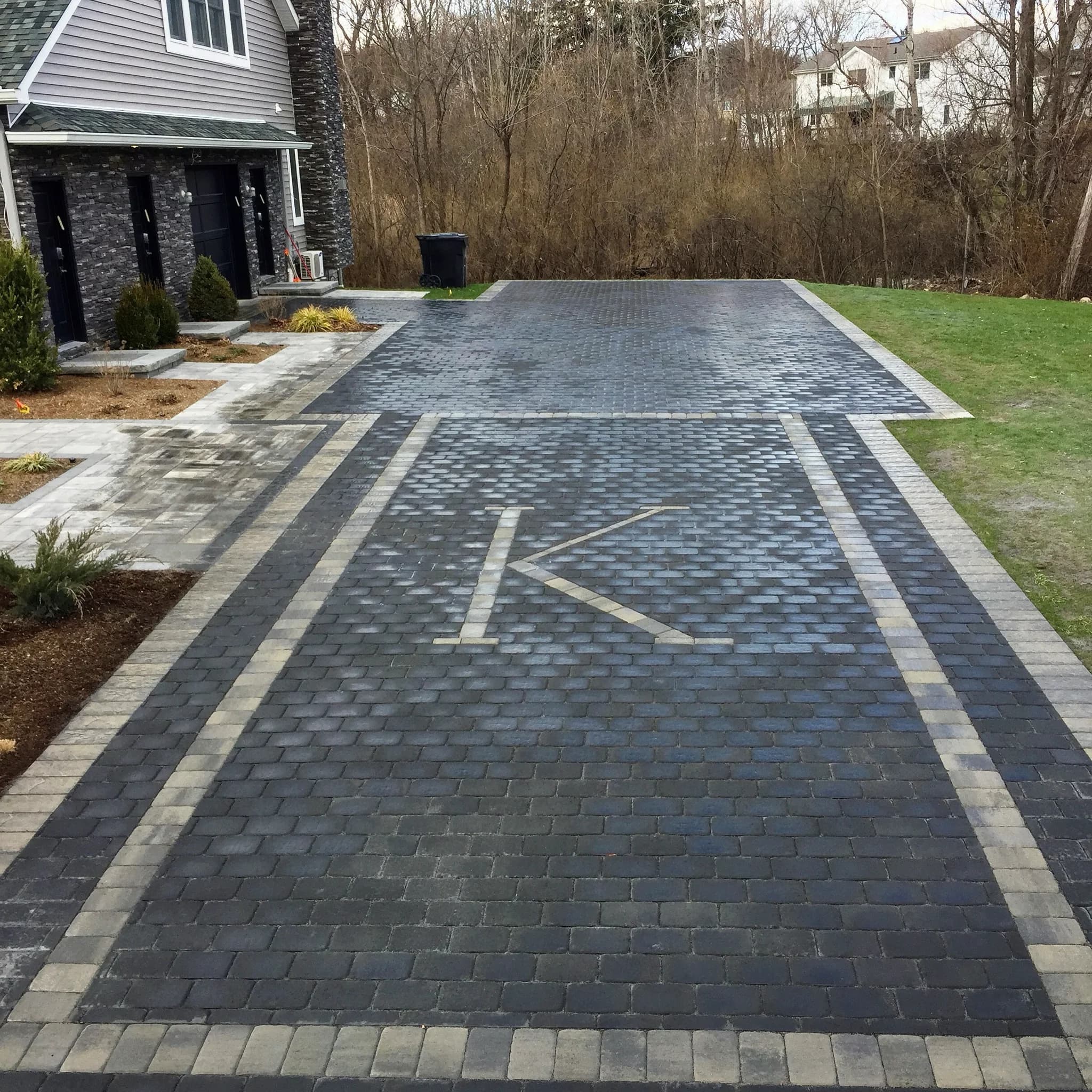 Custom stone masonry driveway with mortared joints