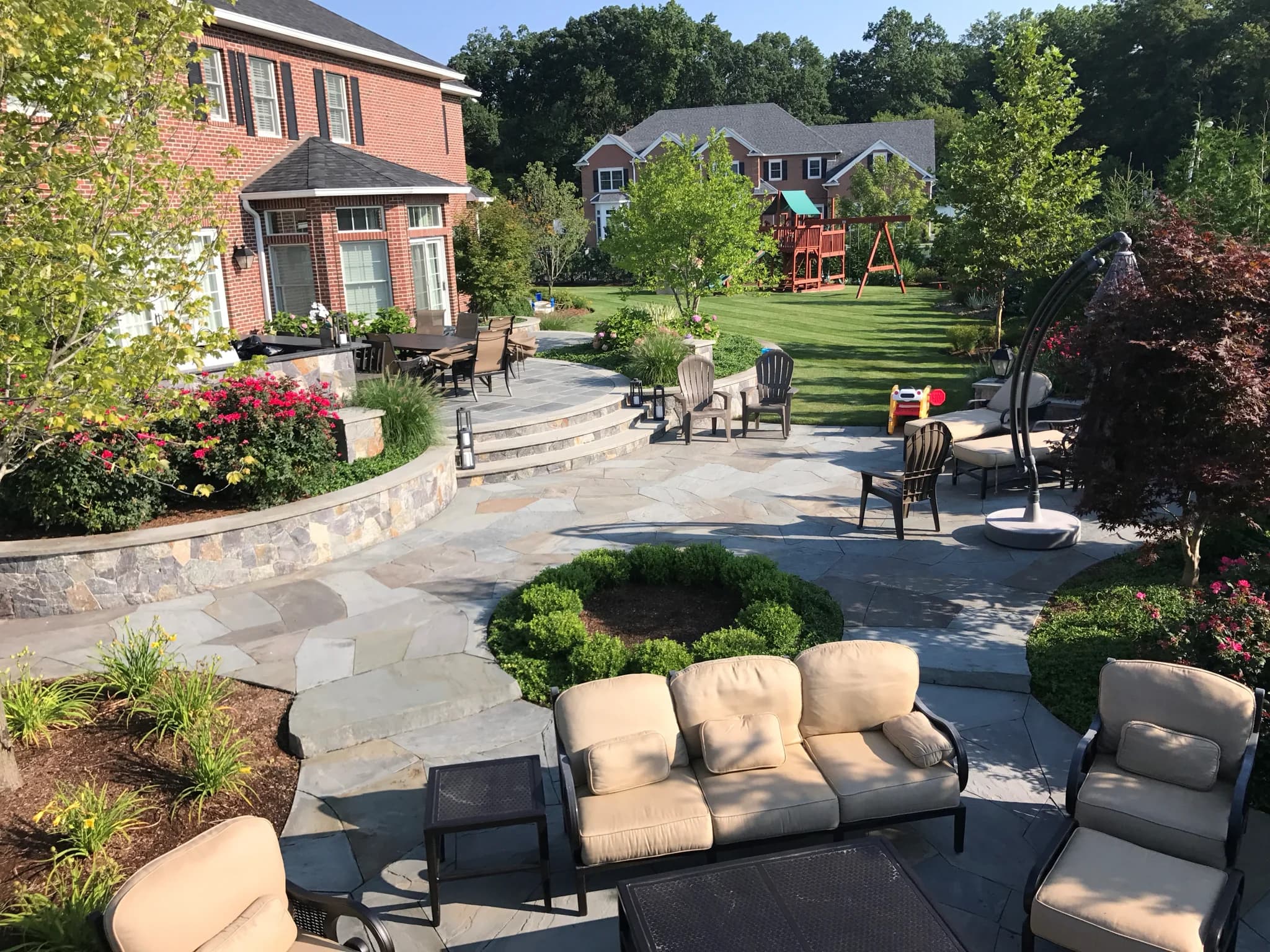 Stone patio with custom masonry borders