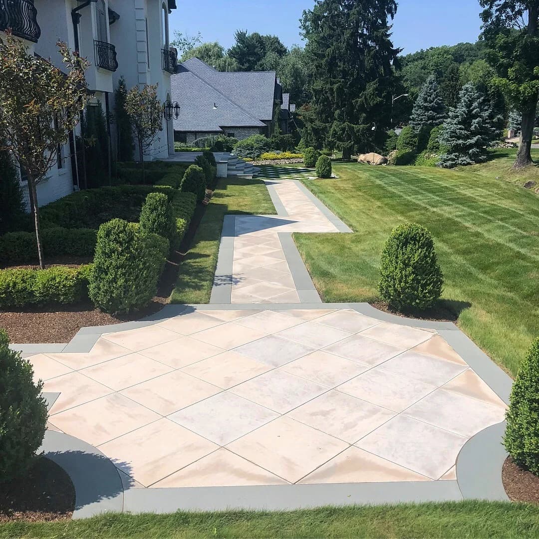 Natural stone patio set into a residential backyard