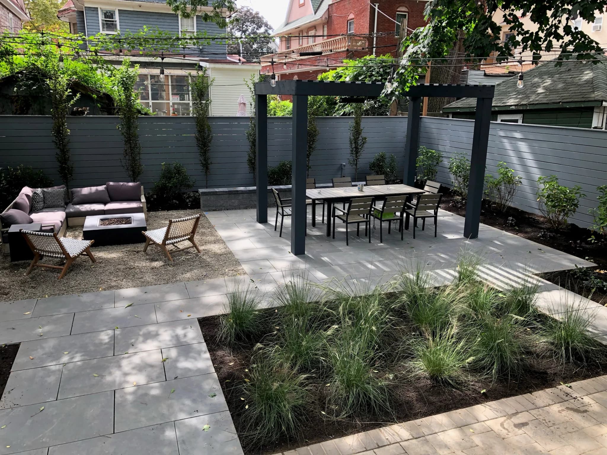 Outdoor cooking area shaded by a timber pergola