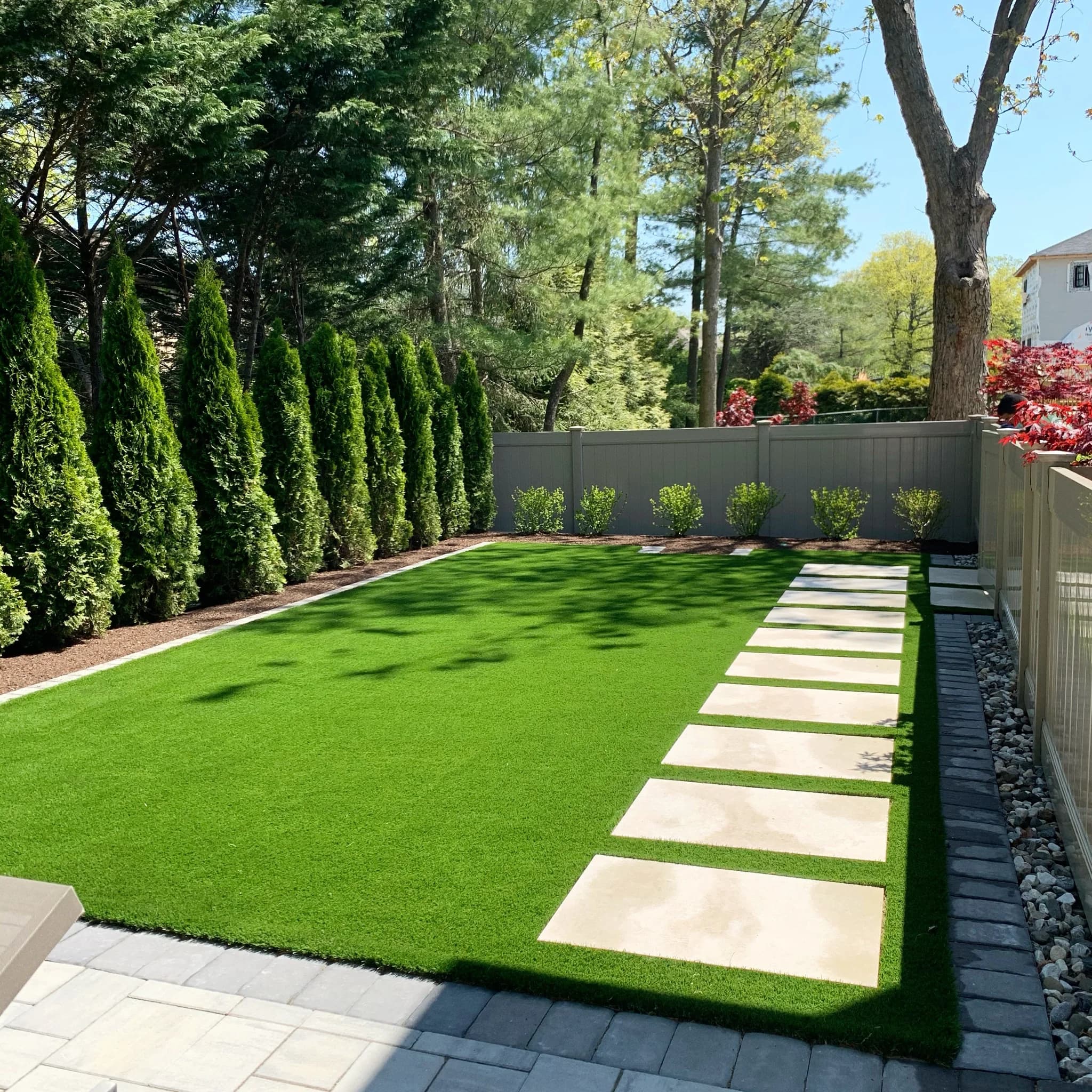 Artificial turf lawn installed in a residential yard
