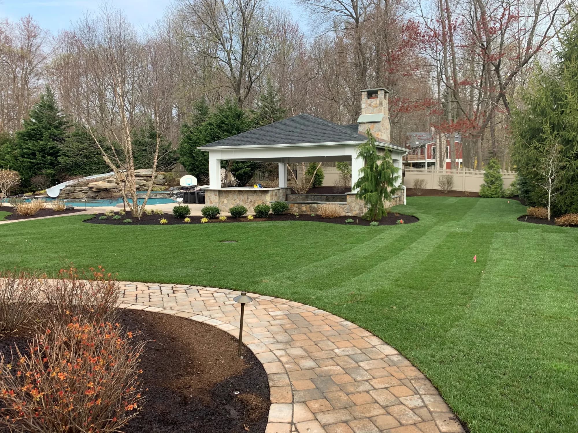 Custom outdoor kitchen with stone base and counter
