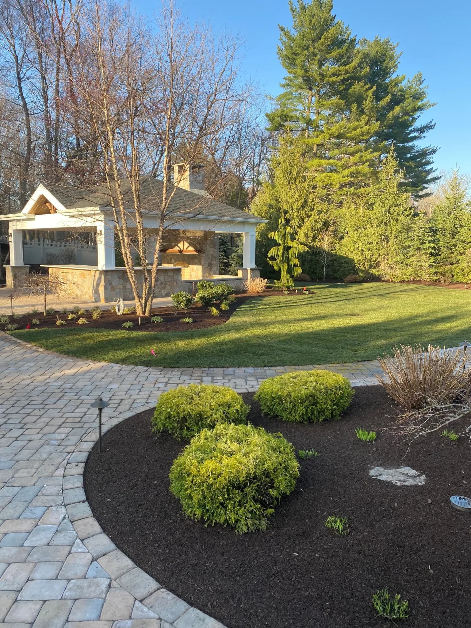 Outdoor kitchen with a built-in grill and stone counter
